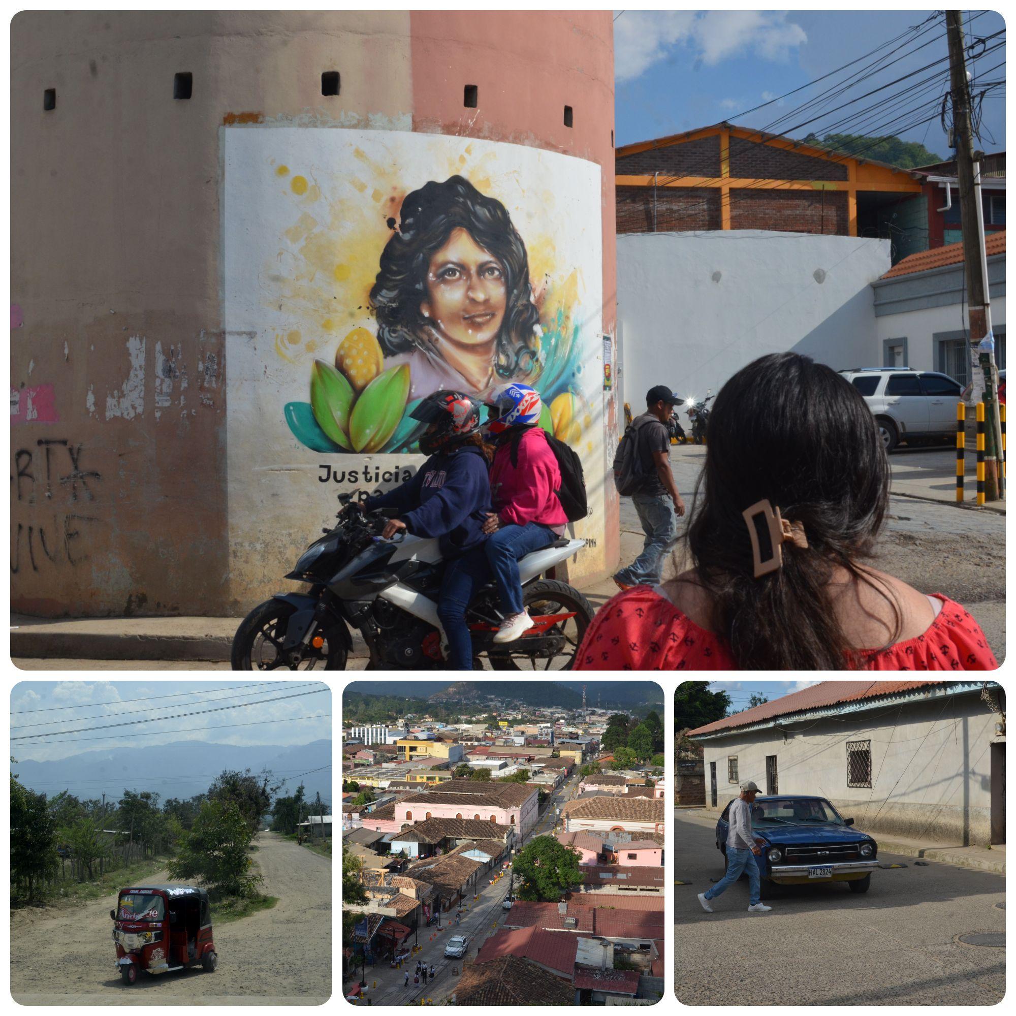 A collage of many photographs from the town of La Esperanza, Intibuca in Honduras. A large photograph is atop three smaller ones. First photograph shows a street view with an indigenous woman with her back turned to the camera as a motorcycle carrying two people passes by. A man walks on the sidewalk and in the background there is a large painting of Berta Caceres.
The second photo shows a red mototaxi speeding on a dirt road. The third photo is a view from a hill of the main street of the town which shows the mainly red adobe tile rooftops of the houses, people and cars are seen from afar. The last photo shows a man crossing the street as an old blue Datsun car is seen behind him waiting for him to cross.