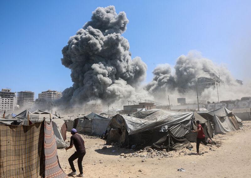 Smoke billows in Gaza City after Israeli strikes on a tower on September 10 2025. (Photo by Omar Al-Qattaa / AFP via Getty Images)